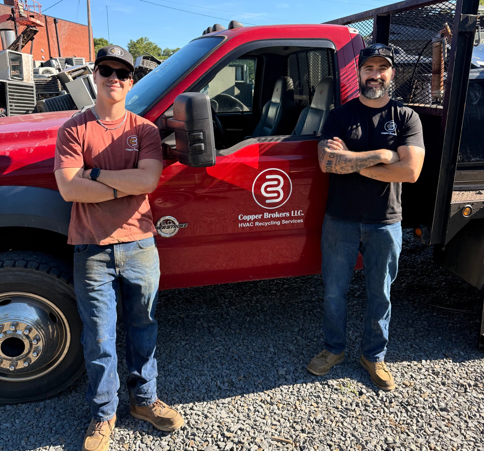 Copper Brokers LLC crew standing beside their branded service truck